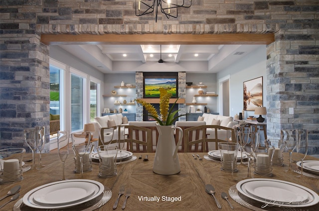 dining area featuring beam ceiling