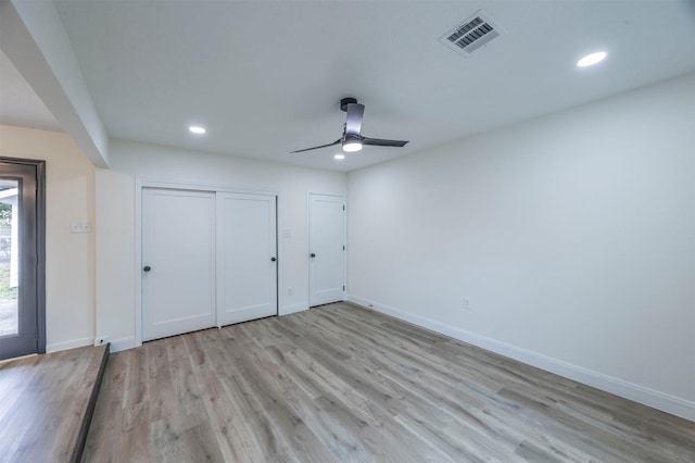 unfurnished bedroom featuring ceiling fan and light hardwood / wood-style flooring