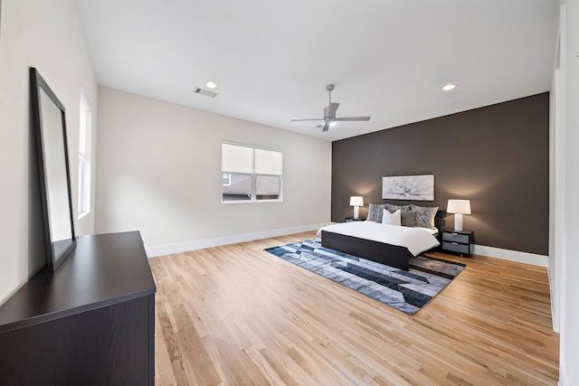 bedroom featuring light hardwood / wood-style floors and ceiling fan