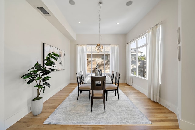 dining space with light wood-type flooring