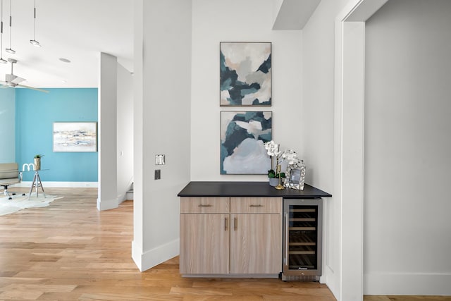 hallway featuring wine cooler and light hardwood / wood-style floors