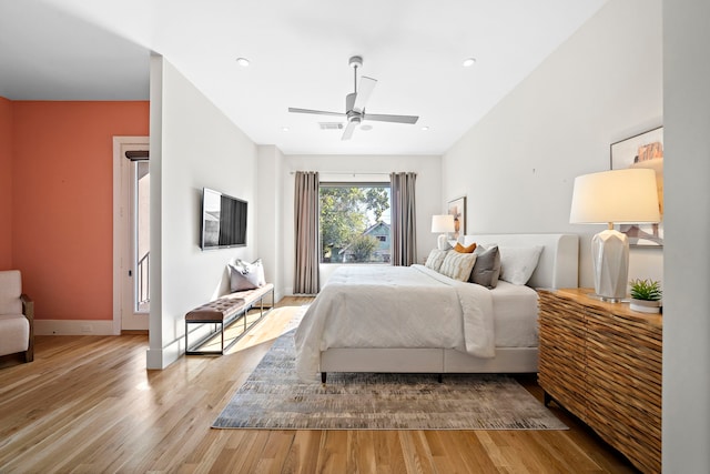 bedroom with ceiling fan and light wood-type flooring