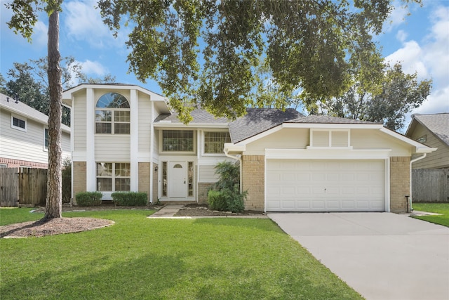 view of front facade with a garage and a front lawn