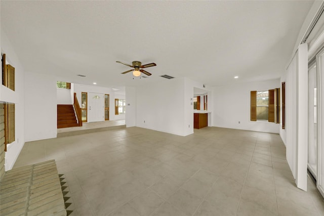 3327 Larkwood Ln, Sugar Land, TX 77479 - unfurnished living room featuring stairway, recessed lighting, ceiling fan, and light tile patterned floors