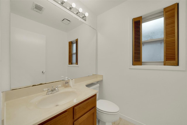 3327 Larkwood Ln, Sugar Land, TX 77479 - bathroom with toilet, vanity, baseboards, and tile patterned flooring