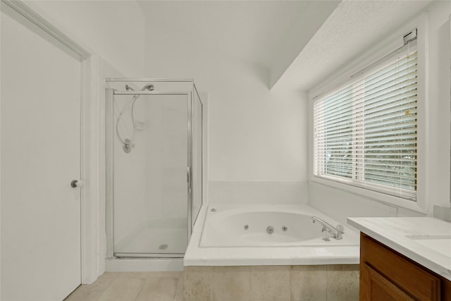 bathroom with vanity and independent shower and bath