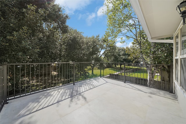 view of patio featuring a balcony