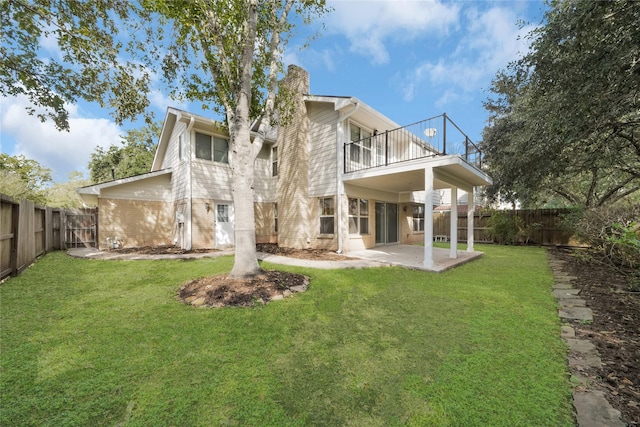 3327 Larkwood Ln, Sugar Land, TX 77479 - back of house featuring a balcony, a chimney, and a patio