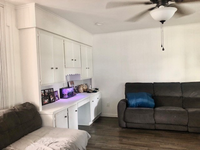 living room with ceiling fan, dark hardwood / wood-style floors, and ornamental molding