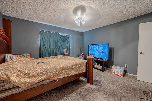 bedroom featuring a textured ceiling, carpet flooring, and ceiling fan