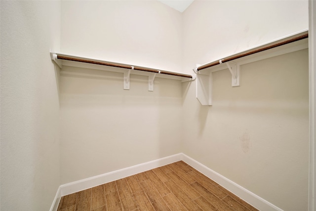 spacious closet featuring hardwood / wood-style flooring