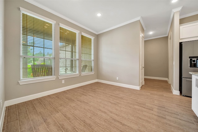 interior space featuring light hardwood / wood-style floors and crown molding