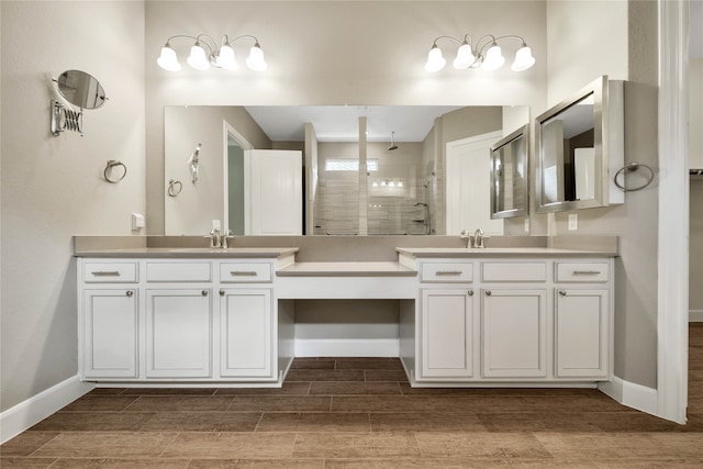 bathroom with an enclosed shower, vanity, and hardwood / wood-style flooring