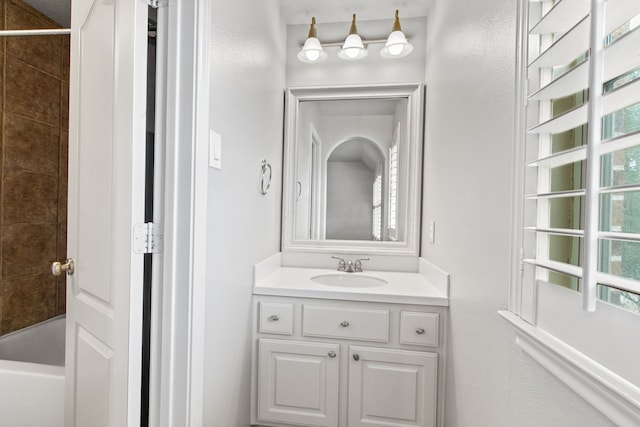 bathroom featuring vanity and shower / washtub combination