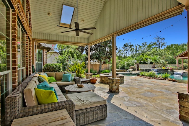 view of patio featuring a pool with hot tub, ceiling fan, and an outdoor living space