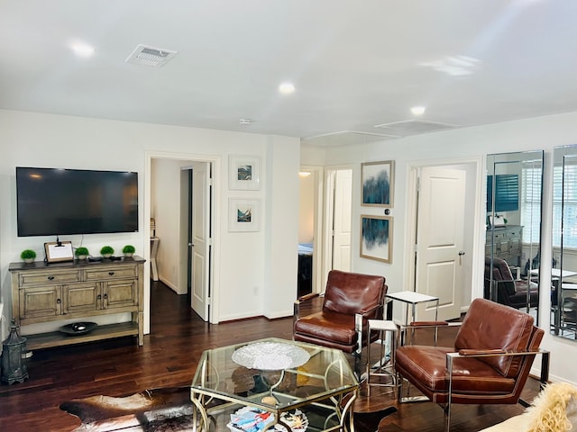 2817 Houston Ave, Houston, TX 77009 - living area with attic access, dark wood finished floors, and baseboards