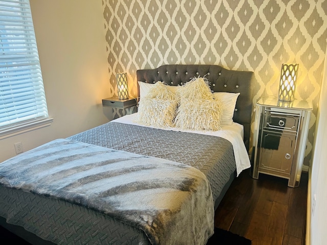 2817 Houston Ave, Houston, TX 77009 - bedroom with wallpapered walls and wood-type flooring