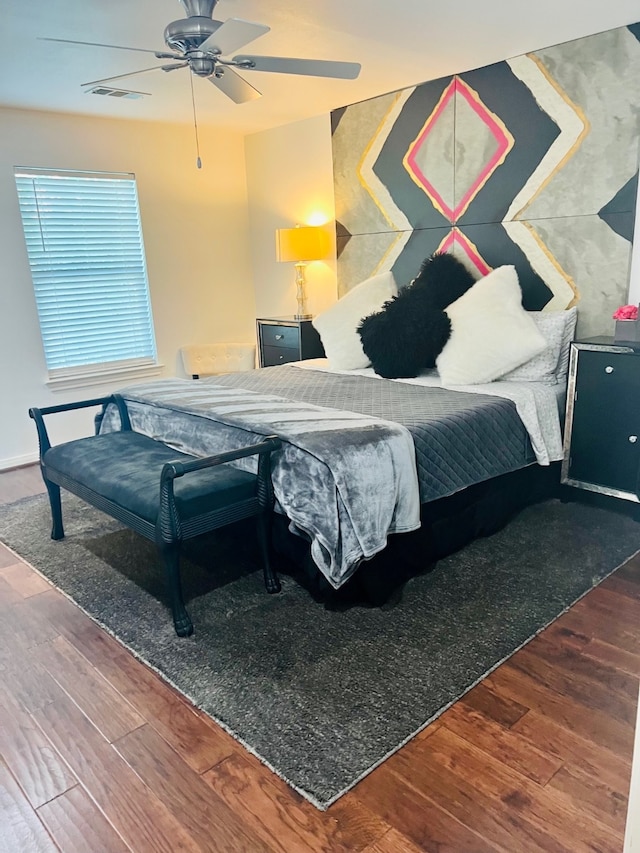 bedroom featuring ceiling fan and dark hardwood / wood-style floors