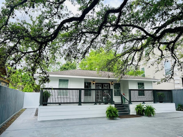 2817 Houston Ave, Houston, TX 77009 - view of front of property featuring a porch, fence, and concrete driveway