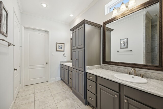 bathroom with ornamental molding, vanity, and tile patterned floors