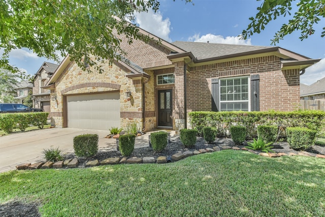 view of front facade with a garage and a front yard