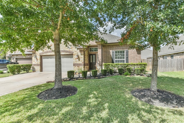 view of front facade featuring a garage and a front yard