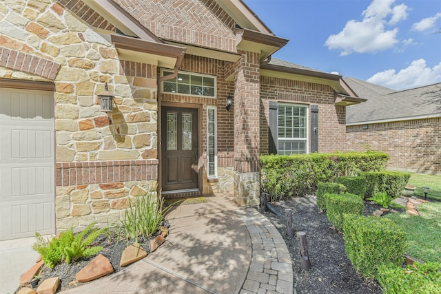 view of exterior entry featuring a garage