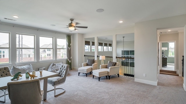 interior space featuring visible vents, baseboards, a wealth of natural light, and light colored carpet