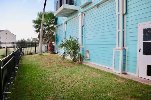 view of property exterior with a lawn