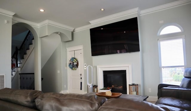 1007 Lillian Ln, Galveston, TX 77554 - living area with ornamental molding, stairs, healthy amount of natural light, recessed lighting, and baseboards
