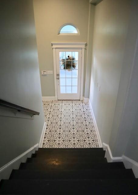 1007 Lillian Ln, Galveston, TX 77554 - stairway featuring baseboards