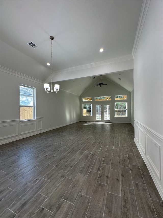 interior space featuring dark hardwood / wood-style flooring, lofted ceiling, ceiling fan with notable chandelier, and crown molding