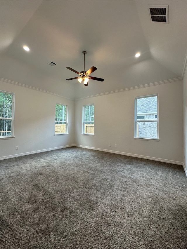 spare room featuring ornamental molding, ceiling fan, vaulted ceiling, and dark carpet