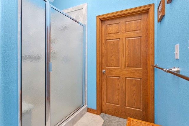 bathroom featuring a stall shower