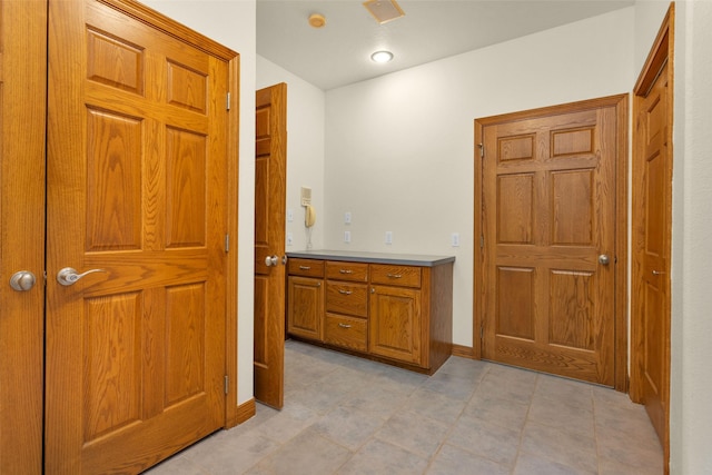 bathroom with vanity and baseboards