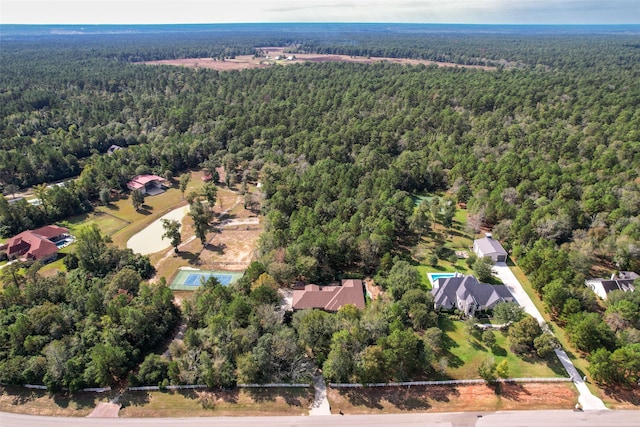 aerial view featuring a wooded view