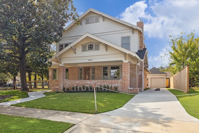 view of front of property featuring a front lawn and a garage