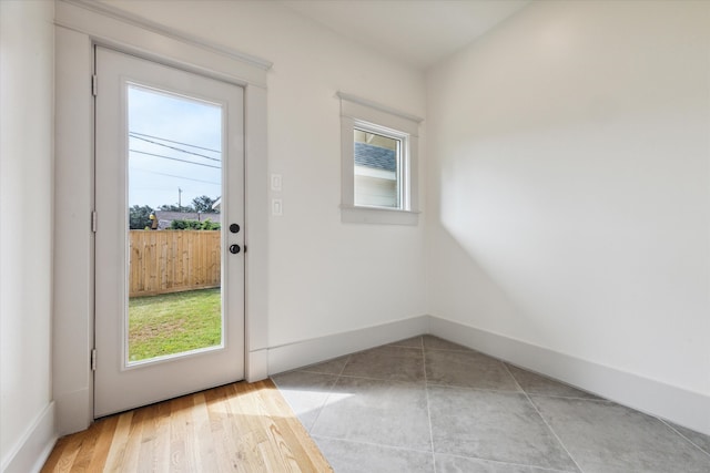 entryway featuring a healthy amount of sunlight and light hardwood / wood-style flooring