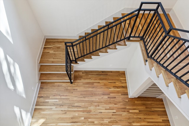 staircase featuring hardwood / wood-style flooring