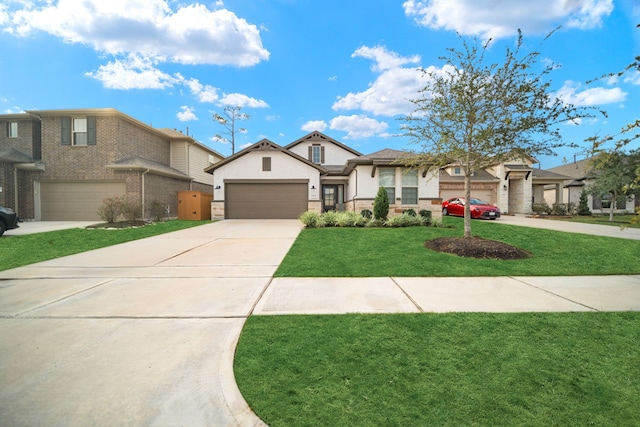 view of front facade with a garage and a front lawn