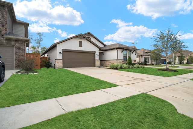 view of front of house with a garage and a front yard