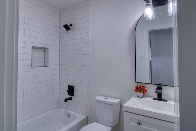 full bathroom with tiled shower / bath, toilet, and vanity