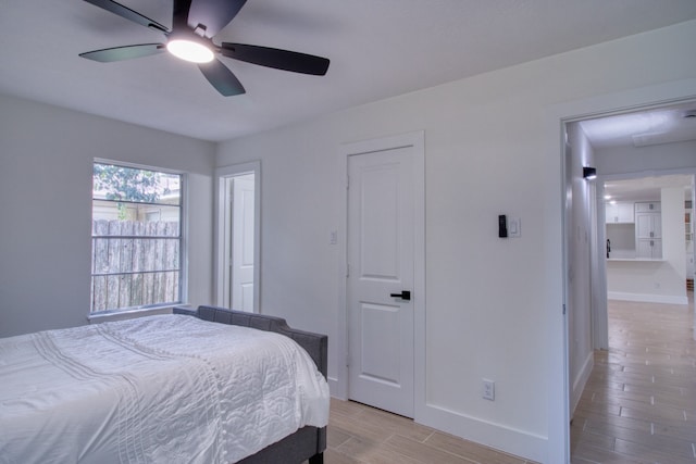 bedroom with light hardwood / wood-style flooring and ceiling fan