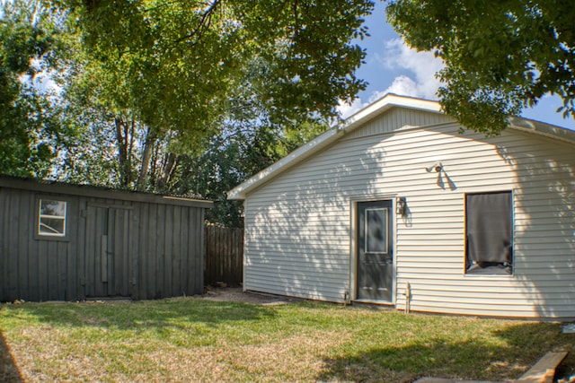 rear view of property with a yard