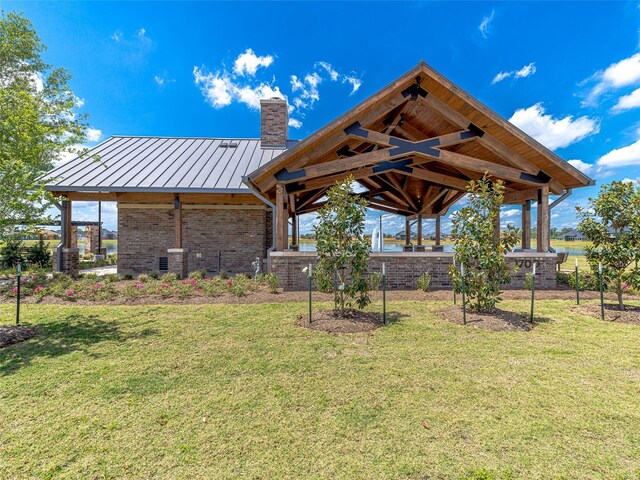 view of yard with ceiling fan and a gazebo