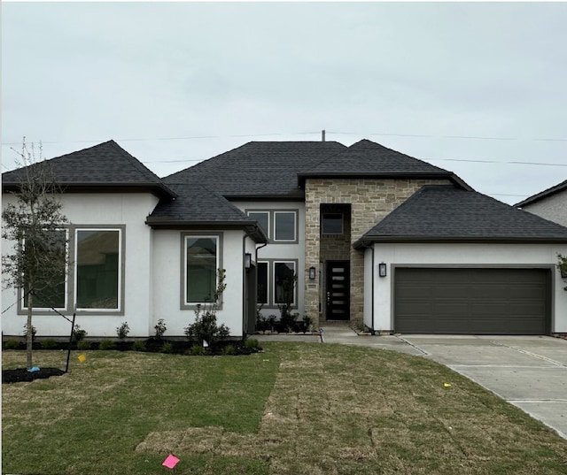 view of front of house featuring stone siding, roof with shingles, driveway, and a front lawn