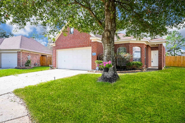 view of front facade with a front yard and a garage