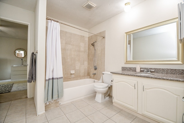 full bathroom with toilet, vanity, tile patterned floors, and shower / tub combo with curtain