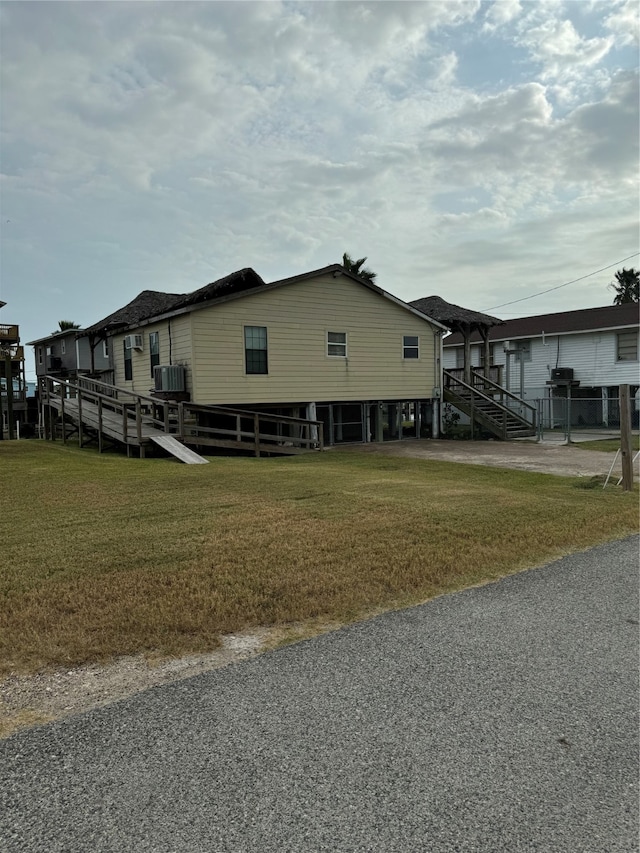 view of side of home featuring a yard