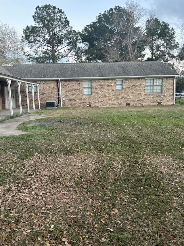 view of home's exterior with a lawn